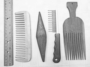 Variations of combs that I have seen used in the past. They include a wooden comb, A very old traditional Bulgarian tapestry pick used for combing given to me by a friend used for combing and placing weft, dog combs, and a Traditional African tribal African hair comb.