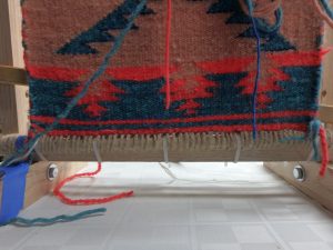 navajo style weaving twined and then wrapped to a dowel